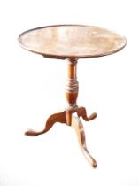 Georgian Oak tripod tip top table, d.59cm x h.70cm.