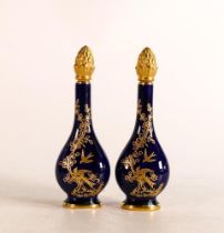 A pair of Lynton Porcelain hand painted scent bottles. Bird scenes to both sides in raised
