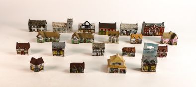 A collection of Wade Whimsey-on-Why Village figures including numbers 1, 4, 8, 10, 15, 20, 22, 24,