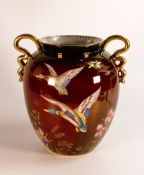 Large Carlton ware handled vase decorated with flying ducks, height 23.5cm, crazing to base.