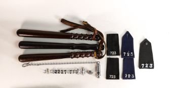 Three heavy vintage Police truncheons together with similar uniform lapels, police whistle & badges.