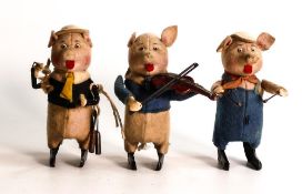 Three Schuco clockwork Three Little Pigs band. One playing the violin (hat missing), one playing the