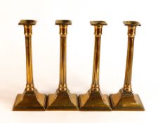 Set of four 19th century Brass push cp Corinthian column candlesticks, height 26cm (4)