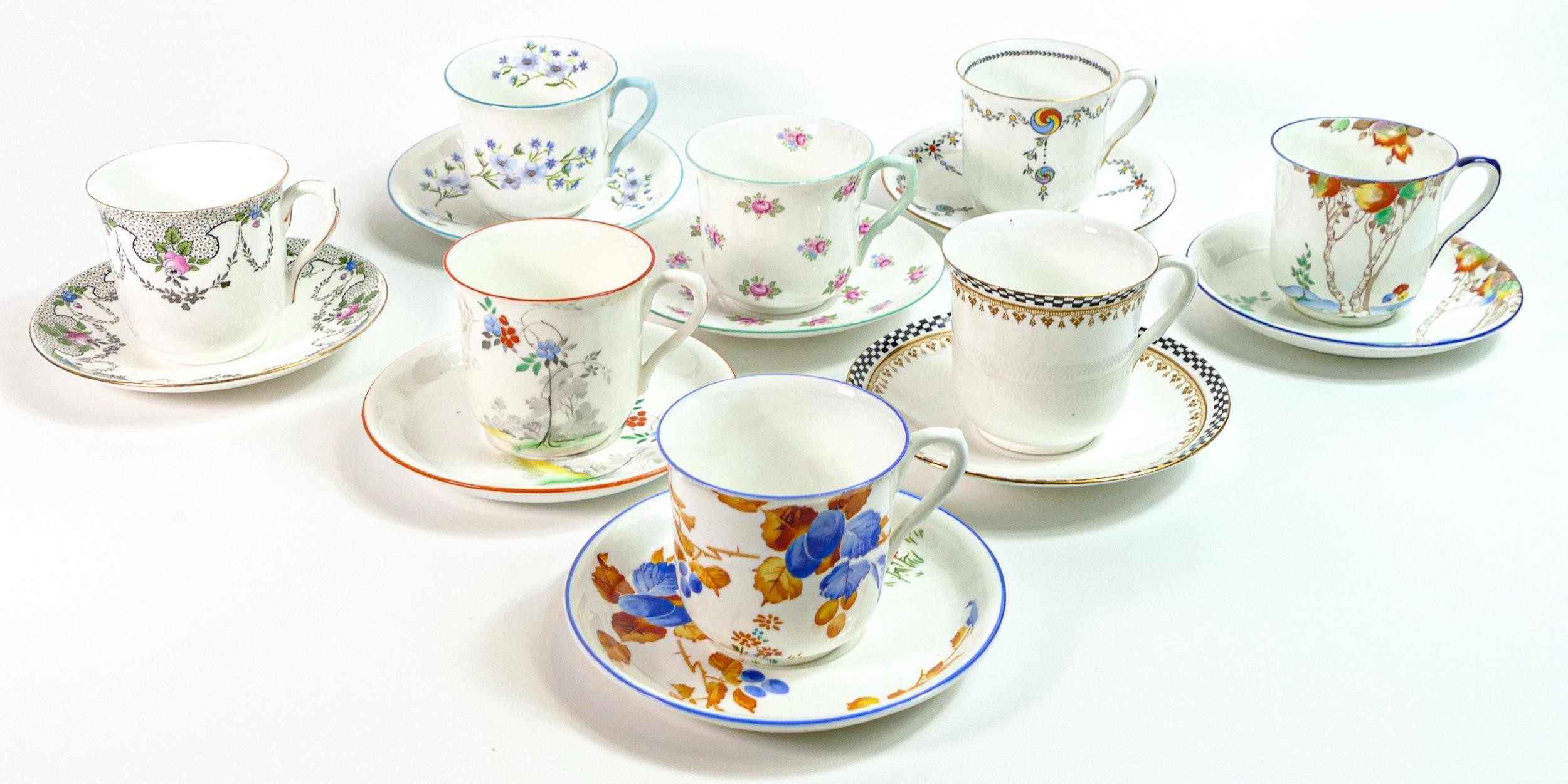 Eight Shelley Vincent shape cups & saucers. Patterns 11886, 11004, 2118, 13426, 13591, 10797,