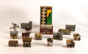 A collection of Wade Whimsey-on-Why houses and miniature candles with holders. (16)