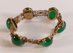 9ct gold bracelet set with six oval green stones, total weight 20.9g.