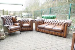 Quality leather Chesterfield three piece suite, comprising three seater settee, club low armchair