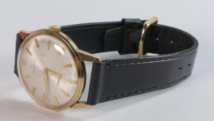 Helvetia 9ct gold mechanical wristwatch with seconds dial & black leather strap.