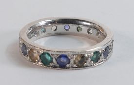 18ct hallmarked white gold full eternity gemstone set ring size R. Set sapphires, emeralds & others.