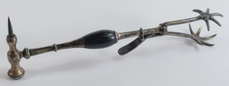 A rare and unusual pair of Victorian silver plated spring loaded ice tongs with a turned wooden
