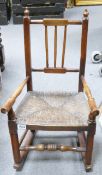 19th century child's Elm stick back rocking chair with straw seat and of good colour, h.72 x w.40cm.