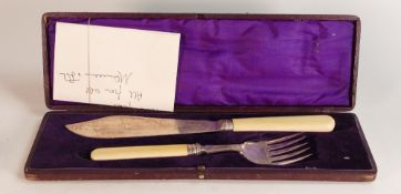 Cased silver fish knife and fork with bone handles.
