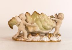 Carlton ware Wiltshaw & Robinson Ivory centre vase in the form of two putti supporting a large faded