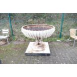 Very large metal ornamental and architectural garden urn and cast iron base in the Arts and Crafts