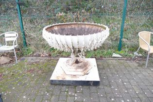 Very large metal ornamental and architectural garden urn and cast iron base in the Arts and Crafts