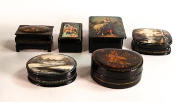 A collection of Russian Lacquer ware boxes, decorated with figural and architectural views. All have