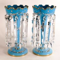 A pair of turquoise Opaline lustres with gilt banding to rim and base. Enamelled floral swags to