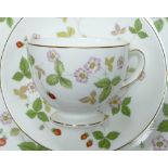 Wedgwood Wild Strawberry pattern dinner & tea ware to include cups, saucers, side plates & varying