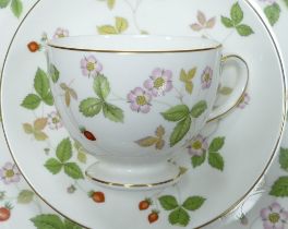 Wedgwood Wild Strawberry pattern dinner & tea ware to include cups, saucers, side plates & varying