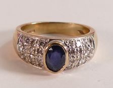 9ct gold ladies ring set with oval blue stone and diamond cluster shoulders, ring size O, 6.1g.