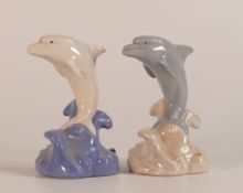 Two Wade Aqualand Dolphins in different colourways, one with a sticker to base stating back stamp