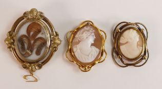 Two gilt metal cameo brooches 52mm & 46mm high appx., together with larger swivel mourning brooch