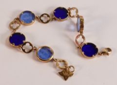 9ct gold bracelets set with light and dark blue circular glass roundels each decorated with cupids
