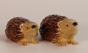 Wade mother and baby hedgehogs, marked with the initials KM to base. This lot was removed from the