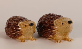 Wade mother and baby hedgehogs, marked with the initials KM to base. This lot was removed from the