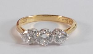 18ct gold three stone diamond ring, good lively diamonds, centre stone approx. .35ct, and two others