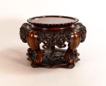 20th century Chinese carved hardwood plant stand, d.25cm.