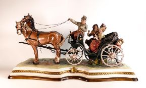 Capodimonte sculpture of a carriage drawn by two horses, with driver, courting couple and a young