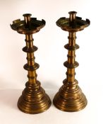 A pair of Brass Ecclesiastic candlesticks. Pierced simplified Quatrefoil pattern to top and base.