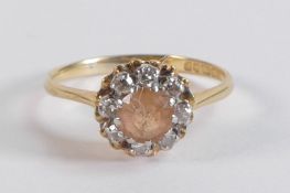 18ct gold ladies dress ring set with light brown centre stone surrounded by diamonds, size P, 3.3g.