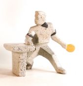 A Cubist ceramic model of a table tennis player. Height: 19.3cm Small surface chips to cuffs of