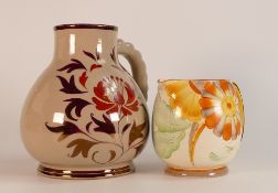 Two Gray's Pottery jugs, one Susie Cooper stylised floral jug together with one larger example in
