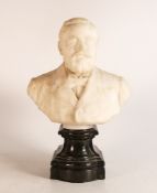 19th/20th century white marble bust of a bearded man mounted on a black marble shaped base, h.27 x