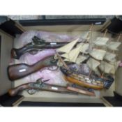 3 Reproduction Pistols together with a wooden model of a HMS victory ship