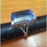 Ornate Silver ring set with large rectangular blue semi-precious stone, overall weight 10.8g (