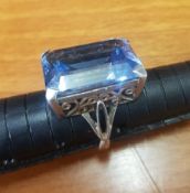 Ornate Silver ring set with large rectangular blue semi-precious stone, overall weight 10.8g (