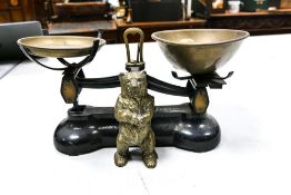 A pair of Libra vintage kitchen scales together with a brass bear money box