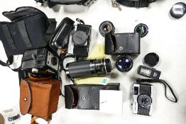 A collection of vintage camera equipment to include Olympus Trip 35, Minolta Autopak 700, Bayonnet