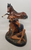 Beswick brown gloss horse sitting down together with Royal Doulton Matt figure Buddies' HN2546 (2)