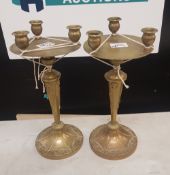 A pair of 3 branch brass candle sticks