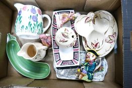 A mixed collection of items to include Bristol hand decorated jug, Wade Toby jug & raised relief