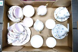 Two 21-piece teasets to include one Sutherland China example and one in a Polka Dot pattern by Royal