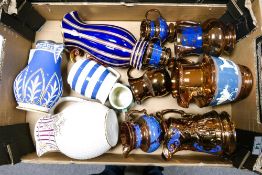 A mixed collection of items including 19th Century Raised Relief jugs, metallic glazed jugs etc