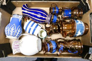 A mixed collection of items including 19th Century Raised Relief jugs, metallic glazed jugs etc