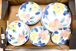 A collection of Johnson Bros floral decorated plates