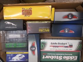 A mixed collection of boxed toy cars to include eddie stobart, classic coaches collection, jaguar,